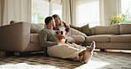 Couple, love and dog with smile on sofa for care, play and happy for bonding or connection in home. Man, woman and support in living room for pet animal, stroke and relax on couch at family house