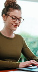 Woman, typing and remote work in home office with laptop, creative inspiration or plan for blog post. Happy, person and freelance writer in house with computer, glasses and online story development.