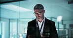 Happy, window and business man on tablet at night for research, investment portfolio and planning. Corporate office, finance and mature person on tech for financial review, budget and risk assessment