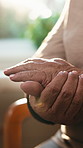 Hands, pain and senior person in house with arthritis inflammation, gout or osteoporosis. Injury, sore fingers and woman with chronic condition, fibromyalgia and massage for joint ache in retirement