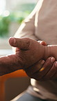 Hands, wrist pain and senior person with arthritis inflammation, strain or osteoporosis in house. Injury, sore and woman with chronic condition, fibromyalgia and carpal tunnel at home in retirement