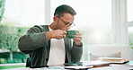 Freelancer, coffee break and man with laptop in home office, think and financial report with graphs. Data analyst, flare and person with technology, remote work and drinking warm beverage in house