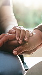Holding hands, caregiver and old woman at house for comfort, empathy and support for diagnosis. Nurse, consoling and senior person in lounge with sympathy, elderly care and hope for medical treatment