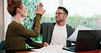 High five, finance and couple with paperwork, laptop and budget planning for mortgage in home. Marriage, happy and man with woman with documents for financial report, audit success and online banking