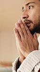 Thinking, worry and man in home with anxiety for decision, nervous and concern for unemployment. Hands, mental health and person with uncertainty, wondering and reflection for mistake or job loss