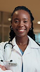 Arms crossed, face and laughing with doctor black woman in hospital at night for care or support. Confidence, funny and healthcare with happy medical professional in clinic for help or service
