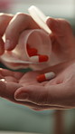 Home, pour and hands of person with pills for treatment, antibiotics and medicine for recovery. Healthcare, house and woman with medication, tablets and capsule for prescription, wellness and cure