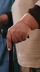 Senior, hands and nurse with cane for assisted living, physiotherapy or balance in home. Female person, caregiver or helping elderly patient with walking stick for support, mobility or recovery