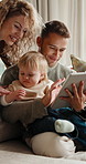 Happy family, tablet and parents with baby for bonding, talking or watch cartoon at home. Tech, mother and father with toddler child for streaming show, relax and smile with care for connection