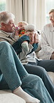 Playing, sofa and grandparents with parents and baby for bonding, relationship and visit on weekend. Family, home and senior people with child for playful connection, love and trust for support