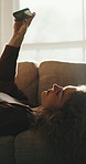 Relax, woman and selfie on sofa for social media post, influencer and smile with photo gallery. Chill, happy person or picture at home for status update, capture memory or content creation on weekend
