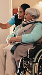 Health, caregiver and old woman pointing in wheelchair for view, sensory stimulation or homecare. Happy, carer and senior person with disability for observing, discovery or curious in assisted living