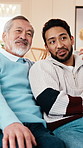 Senior, dad and watching tv with adult son in home for bonding, weekend or movie together. Elderly, father or male person with smile on sofa for entertainment, comfort or online streaming in house