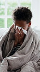 Tissue, fever and child blowing nose on sofa for recovery of allergy infection, flu or cold. Sneeze, sick and boy with symptoms in living room for healing with illness, sinus or congestion in home