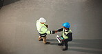Architect, men and handshake with supervisor in building, teamwork or agreement on construction site. People, above and shaking hands for property development, space and civil engineering achievement