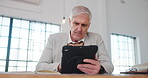 Architect, review or man in office with tablet, design plan or online notes on renovation strategy. Digital, serious or mature engineer with tech, progress checklist or research on remodeling project