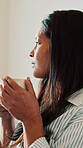 Coffee, relax and thinking with woman in home living room for me time, reflection or stress relief. Drink, morning and quiet with happy person in apartment for calm, inspiration or weekend wellness