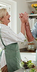 Cooking, salad or old couple in kitchen with high five, happy moment or victory with meal prep. Connection, food or senior people with bonding success, healthy relationship or culinary hobby in home.