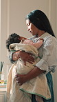 Mom, baby and swaddle with love in home for comfort, rest or peaceful sleeping time together. Mother, child or kid asleep with support, embrace or kiss for affection, parenthood or safety in house
