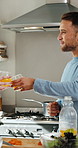 Couple, kitchen and orange juice with baby for morning drink, vitamin C or wellness together. Man, woman and citrus beverage with natural fruit or toddler for nutrition, breakfast or cheers in home