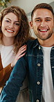 Happy, face and couple with pride in home for holiday comfort, break or bonding together. Portrait, man and woman with smile, love or care for fun weekend, vacation getaway or free time in house