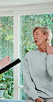 Physiotherapy, tablet and neck pain of mature woman for consultation, online checklist and app. Physical therapy, patient and technology for chiropractic, evaluation and orthopedic wellness at clinic