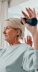 Physiotherapy, dumbbells and mature woman with exercise for rehabilitation, healing and fitness. Healthcare professional, patient and consultation with weights, physio and muscle wellness at clinic