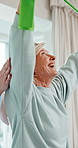 Physiotherapy, resistance band and mature woman with exercise for rehabilitation, healing or fitness. Healthcare professional, patient and consultation with stretching, laugh and wellness at clinic