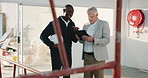 Tablet, team and planning at construction site for maintenance evaluation, renovation or engineering. Tech, contractor and happy men talk for development, quality control or remodeling assessment