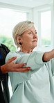 Physiotherapy, stretching and mature woman with exercise for rehabilitation, healing and fitness. Professional man, patient and support with resistance band, physio and muscle wellness at clinic