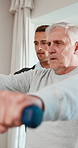 Physiotherapy, dumbbells and mature man with support for rehabilitation, healing and fitness. Healthcare professional, patient and consultation with weights, physio and muscle wellness at clinic