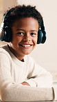 Face, headphones and boy in home with homework, learning assignment and study notes. Portrait, student and kid with audio, online lesson and happy for education, child development and knowledge