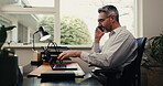 Home office, laptop and man with phone call for wfh, technical audit review or landing page test. Freelance, mature SEO specialist or mobile chat for diagnostic check, web optimization plan or update