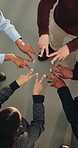 Above, circle and business people hands together for team, support and motivation for goals. Huddle, coworking and men with women in meeting for collaboration, agreement and peace sign in office