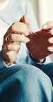 Fingers, hand pain and injury with old woman in home for carpal tunnel, osteoarthritis and inflammation. Tendinitis, healthcare and osteoporosis with senior person in living room in house for gout