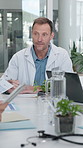 Doctor, man and meeting in clinic with medical records, patient case review and treatment options. Writing, mature worker and discussion for diagnosis report, care coordination and clinical opinion