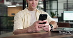 Hands, business and man in office with phone, research and finance analysis for accounting. Smile, male person or review in workplace with mobile app, financial stats and profit for revenue analytics