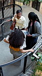 Business, people and conversation with colleagues on staircase for team social or chat together. Above, employees or friendly discussion with arrival in workplace for company gathering or schedule