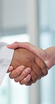 Medical, greeting and team in hospital with handshake, thank you and support in end of surgery. Space, people and doctors with shaking hands, well done and healthcare collaboration in post operation.