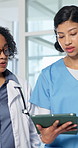 Medical team, discussion or walk with tablet in hospital for training, telehealth report or schedule. Tech, women and talk with healthcare nurse, intern or doctor mentorship with advice for planning