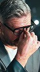 Night, businessman and stress with glasses for eye strain, overworked or deadline in office. Mature, man or employee working late with headache for business pressure, bad news or mistake in workplace