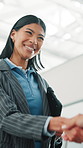 Architect, woman and shaking hands at construction site with smile, renovation approval or agreement. Low angle, happy person and handshake in building with architecture, project success or teamwork.