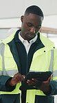 Engineer, development and serious man with tablet in building for quality assurance checklist. Person, construction and tech to scroll inspection report, track progress or problem solving at site