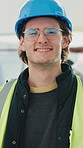 Construction, face or man on site with smile, building technician or pride in renovation project. Happy, ppe or electrician with about us, remodelling specialist or confidence in industrial industry.