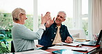 Mature, documents and happy couple laughing with high five in home for asset management together. Man, woman or smile with paperwork, humor or funny joke for financial planning or budget in house