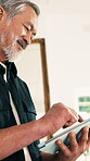 Reading, online and senior man with tablet in home, scroll and smile with article on website or info. Browsing, news and mature person with tech, happy and search for blog with subscription in house
