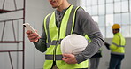 Construction, message or hands on site with phone, task brief or inspection report in online chat. Typing, man or engineer with helmet, project instruction or operations schedule on digital platform.