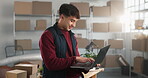 Logistics, laptop and man with boxes for distribution, smile and ecommerce app for shipping parcel. Male person, technology and happy by shelves for storage, stockroom and search on supplier database