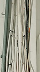 Wiring, building and cable management with electrical insulation, safety compliance and zip tie. Exterior wall, pipes and installation with conduit infrastructure, power and danger prevention
