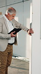Building, inspector and man with tablet, evaluation and safety check on construction site or online. Real estate, property manager and mature person with technology, walking and quality assurance
